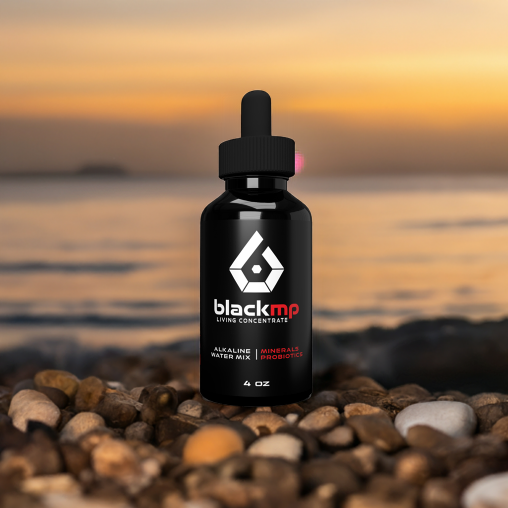 BlackMP Living Concentrate 4oz Fulvic Humic Mineral Supplement with Probiotics on a beach at sunset.